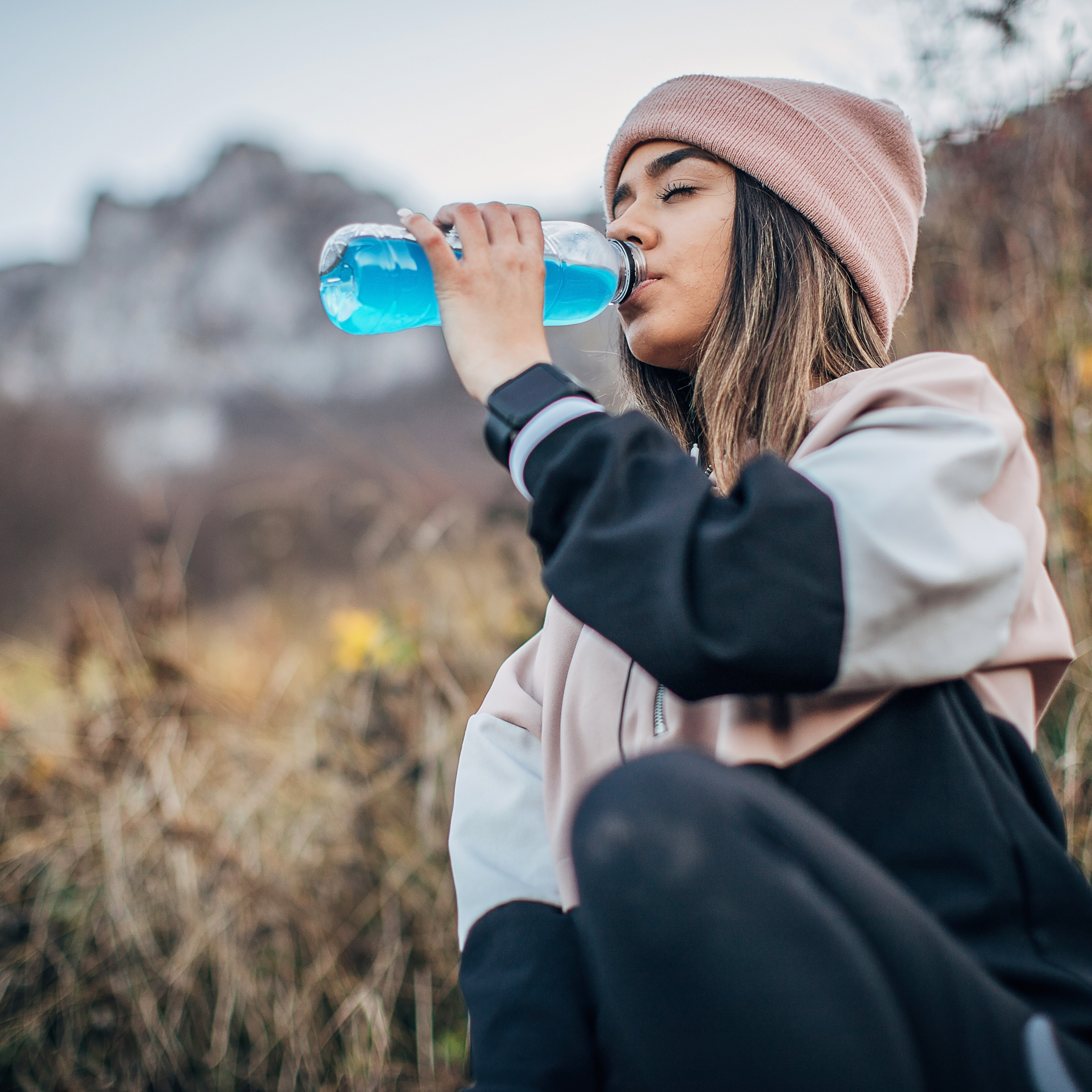 Young girl drinking electrolyte drink